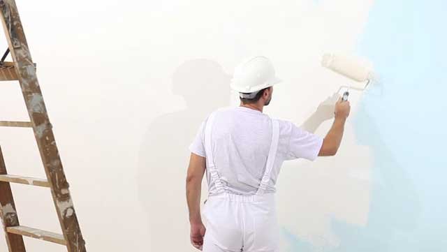 painter painting wall